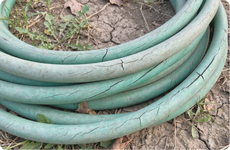 Pile of old cheap plastic sprinklers in a shed