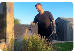 Garden hose connected to outdoor tap